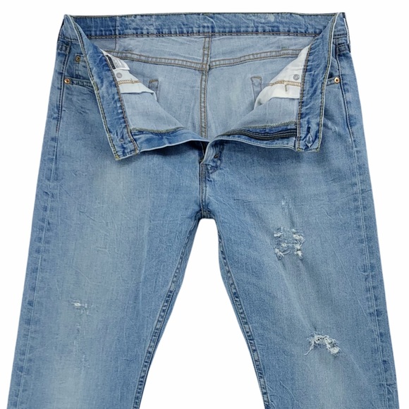 Levi’s 513 Slim Straight Distressed Light Wash Jeans - Picture 7 of 16